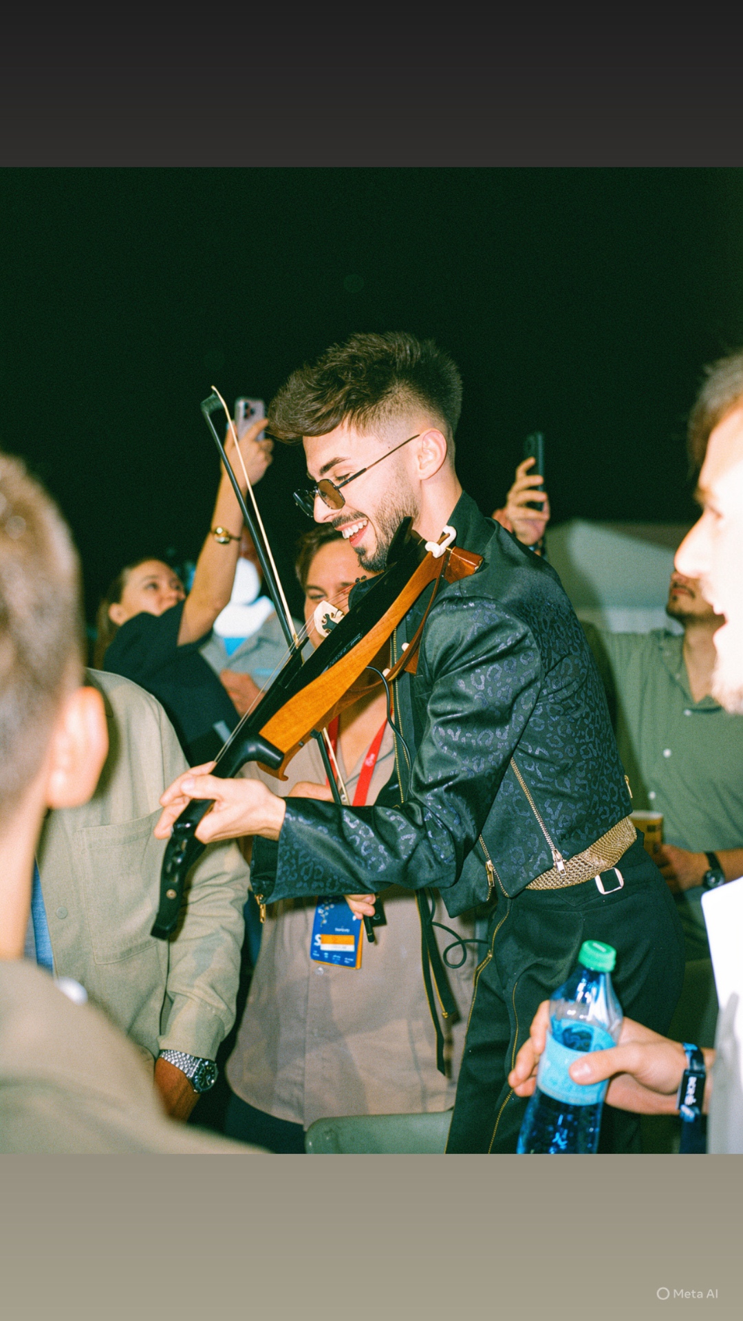Máté Kozma playing violin at a festival